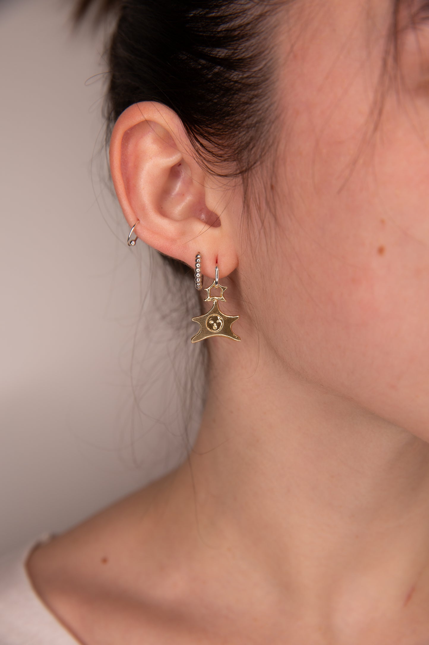 GOLD TONE STAR BABY EARRINGS