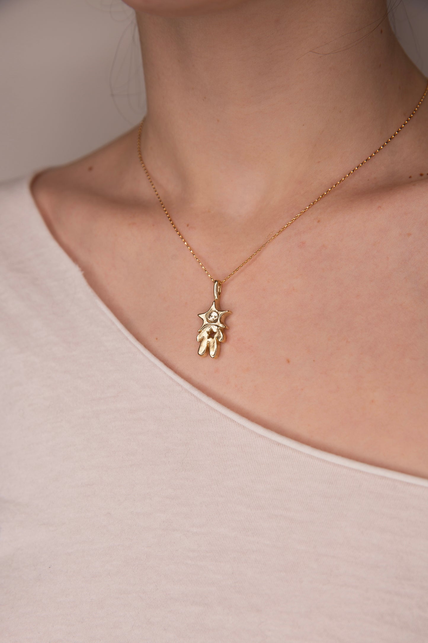 GOLD TONE HOLLOW HEART STAR BABY