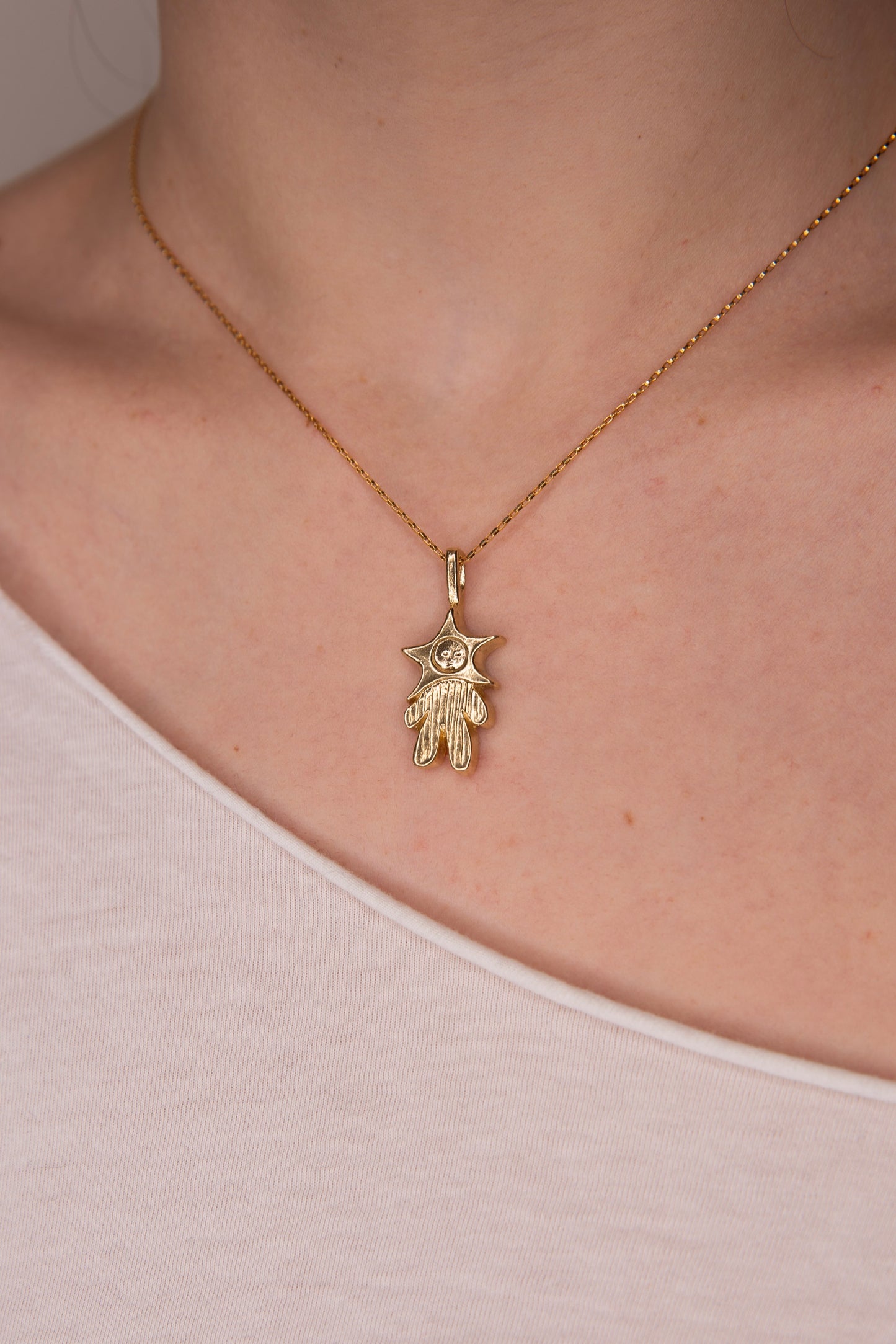 GOLD TONE PINSTRIPED STAR BABY